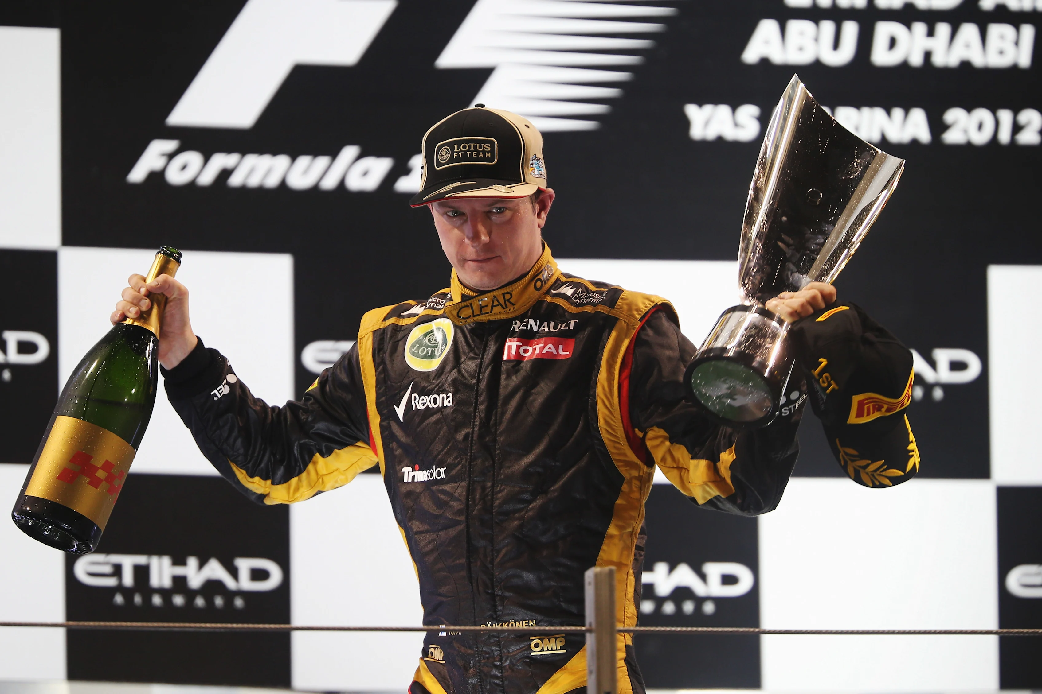 ABU DHABI, UNITED ARAB EMIRATES - NOVEMBER 04: Kimi Raikkonen of Finland and Lotus celebrates on